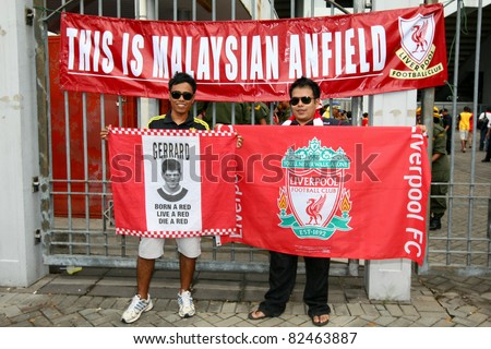 BUKIT JALIL - JULY 16: Soccer fans show their support for Liverpool FC outside the stadium before the match against Malaysia at the National Stadium on July 16, 2011, Bukit Jalil, Malaysia.