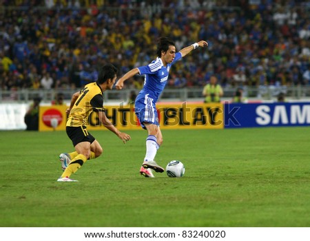 BUKIT JALIL, MALAYSIA - JULY 21: Chelsea\'s Yossi Benayoun (blue) traps the ball down in control in this match against Malaysia in the National Stadium on July 21, 2011 in Bukit Jalil, Malaysia. Chelsea won 1-0.