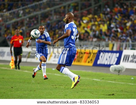 BUKIT JALIL, MALAYSIA- JULY 21: Chelsea\'s Nicolas Anelka (R) chests down the ball in this game against Malaysia at the National Stadium on July 21, 2011 in Bukit Jalil, Malaysia. Chelsea won 1-0.