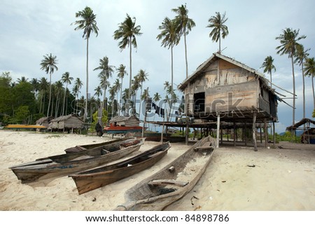 Sea gypsy cottage home on a desolated island off the Borneo Island coast.