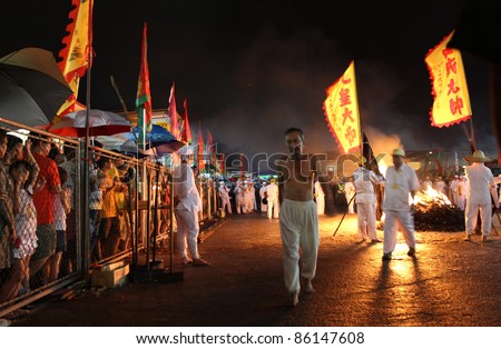 AMPANG, MALAYSIA – OCT 05: Taoist devotees starts the bare-footed fire-walk ceremony at the Lam Thian Kiong Temple during the annual ‘Nine Emperor Gods’ Festival on October 05, 2011 in Ampang, Malaysia.