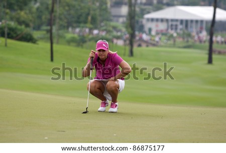 KUALA LUMPUR, MALAYSIA - OCTOBER 16: Anna Nordqvist of Sweden lines up for a putt at the Sime Darby LPGA Malaysia 2011 golf tournament held at the Kuala Lumpur Golf & Country Club on October 16, 2011.