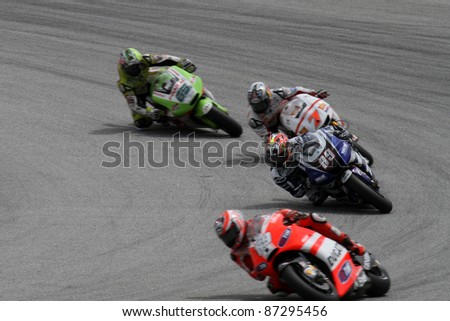 SEPANG, MALAYSIA - OCTOBER 22: MotoGP riders compete for start positions at the qualifying session of the Shell Advance Malaysian Motorcycle Grand Prix 2011 on October 22, 2011 at Sepang, Malaysia.