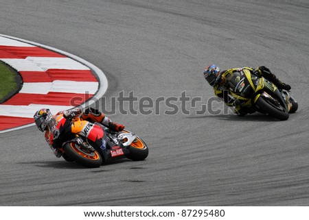 SEPANG, MALAYSIA - OCTOBER 22: MotoGP rider A Dovizioso (4) and Colin Edwards compete at the Shell Advance Malaysian Motorcycle GP 2011 qualifying rounds on October 22, 2011 at Sepang, Malaysia