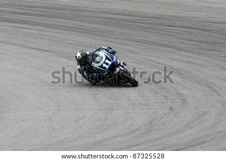 SEPANG, MALAYSIA - OCTOBER 22: MotoGP rider Ben Spies of the USA competes at the qualifying session of the Shell Advance Malaysian Motorcycle Grand Prix 2011 on October 22, 2011 at Sepang, Malaysia.