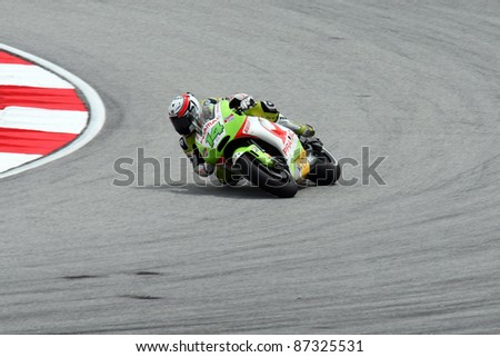 SEPANG, MALAYSIA - OCTOBER 22: MotoGP rider Randy de Puniet competes at the qualifying session of the Shell Advance Malaysian Motorcycle Grand Prix 2011 on October 22, 2011 at Sepang, Malaysia.