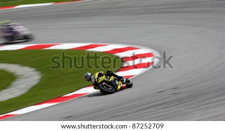 SEPANG, MALAYSIA - OCTOBER 22: MotoGP riders Colin Edwards competes during qualifying session of the Shell Advance Malaysian Motorcycle Grand Prix 2011 on October 22, 2011 at Sepang, Malaysia.