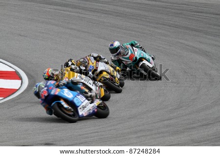 SEPANG, MALAYSIA - OCTOBER 22: Moto2 riders take turn 1 during the qualifying session of the Shell Advance Malaysian Motorcycle GP 2011 on October 22, 2011 at Sepang, Malaysia.