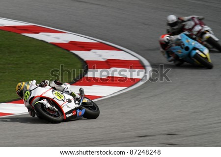 SEPANG, MALAYSIA - OCTOBER 22: Moto2 rider Michele Pirro (51) competes with other riders at qualifying race of the Shell Advance Malaysian Motorcycle GP 2011 on October 22, 2011 at Sepang, Malaysia.