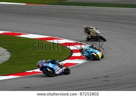 SEPANG, MALAYSIA - OCTOBER 22: Moto2 rider Pol Espargaro (44) leads other riders at the qualifying race of the Shell Advance Malaysian Motorcycle GP 2011 on October 22, 2011 at Sepang, Malaysia.