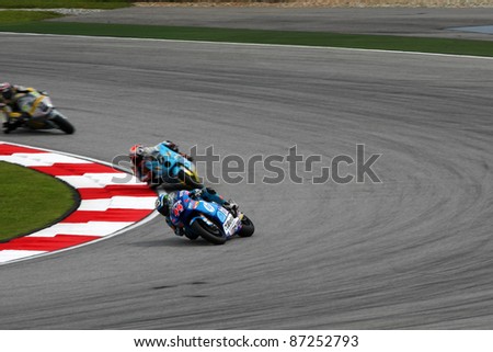 SEPANG, MALAYSIA - OCTOBER 22: Moto2 rider Pol Espargaro (44) leads other riders at the qualifying race of the Shell Advance Malaysian Motorcycle GP 2011 on October 22, 2011 at Sepang, Malaysia.