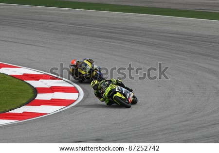 SEPANG, MALAYSIA - OCTOBER 22: Moto2 rider Andrea Iannone (29) takes turn 1 at the qualifying race of the Shell Advance Malaysian Motorcycle GP 2011 on October 22, 2011 at Sepang, Malaysia.