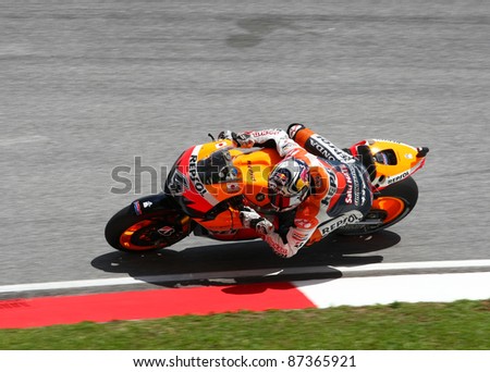 SEPANG, MALAYSIA - OCTOBER 23: MotoGP rider Andrea Dovizioso warms up for the main race of the Shell Advance Malaysian Motorcycle Grand Prix 2011 on October 23, 2011 at Sepang, Malaysia.