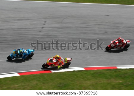 SEPANG, MALAYSIA - OCTOBER 23: MotoGP rider Valentino Rossi (46) warms up with other riders for the main race of the Shell Advance Malaysian Motorcycle GP 2011 on October 23, 2011 at Sepang, Malaysia.