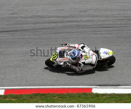 SEPANG, MALAYSIA - OCTOBER 23: Moto2 rider Michele Pirro competes on race day of the Shell Advance Malaysian Motorcycle Grand Prix 2011 on October 23, 2011 at Sepang International Circuit, Malaysia.