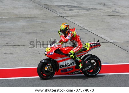 SEPANG, MALAYSIA - OCTOBER 21: MotoGP rider Valentino Rossi leaves the pit lane for a free practice ride on Day 1 of the Malaysian Motorcycle GP 2011 on October 21, 2011 at Sepang, Malaysia.