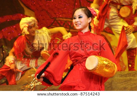 BEIJING, CHINA - NOVEMBER 16: Musicians perform the 'beat the waist drum' dance on November 16, 2005 in Beijing, China. This dance is performed during harvest celebrations in rural China.