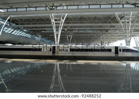 SHANGHAI, CHINA - NOVEMBER 27: A bullet train sits at the Shanghai Hong Qiao station  awaiting for passengers on November 27, 2011 in Shanghai, China. High speed trains cut traveling time by a third.