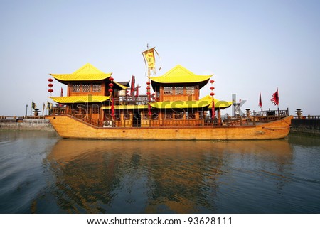 WUXI, CHINA - NOVEMBER 25: An ancient battle ship takes tourists for a cruise at the Tai Lake on Nov 25, 2011 in Wuxi, China. Ships like this took part in the war of the 3 kingdoms in 220AD to 280AD.