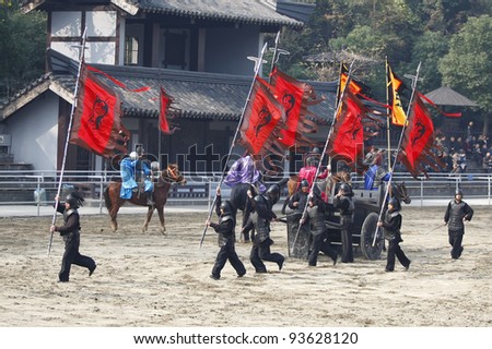 WUXI, CHINA - NOVEMBER 25: Soldiers fight out an ancient war in an outdoor theatre on November 25, 2011 in Wuxi, China.The scene portrays the war of the three kingdoms from 220AD to 280AD in China.