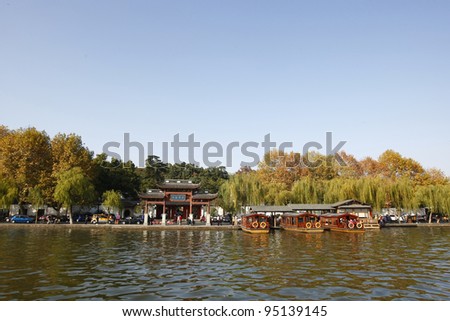 HANGZHOU, CHINA - NOVEMBER 26: Visitors visit the infamous West Lake on November 26, 2011 in Hangzhou, China. It was made a UNESCO World Heritage Site in 2011.