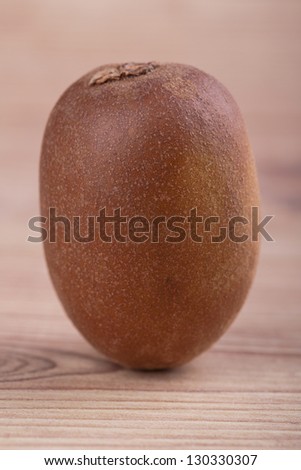Gold kiwi fruit on a wooden background
