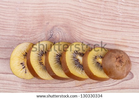 Gold kiwi fruit on a wooden background