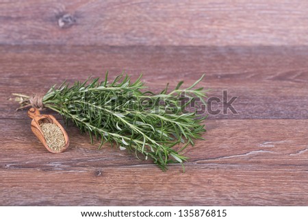 Fresh and dry herbs  on wooden background