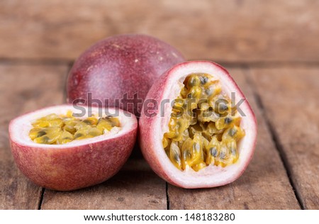 Ripe passion fruit on a wooden background