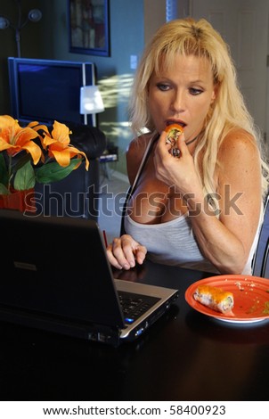 Attractive Blond Eating Sushi on Laptop Computer