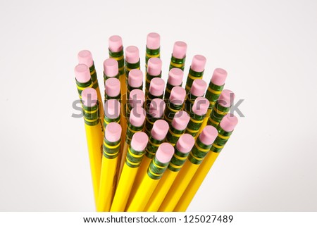 A bunch of number 2 pencil erasers on a white background.