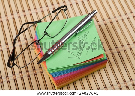Colored notes block with instruments on top