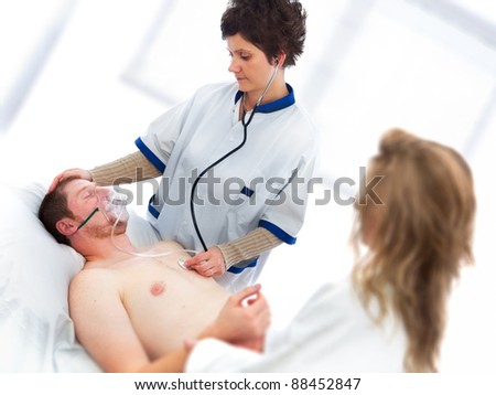 Young man being checked by a doctor for vital signs