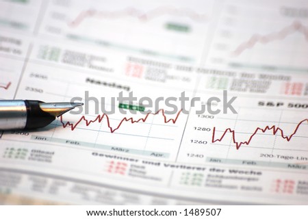 Fountain writing pen on business/finance report