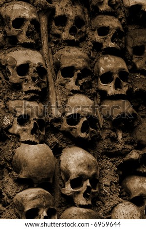 Wall full of skulls and bones in the bone chapel in Evora, Portugal