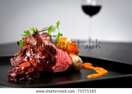 Beef roast with shallot and mushroom wine gravy and side of salt crusted potatoes with red mojo sauce