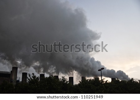 TEPIC, NAYARIT/MEXICO - FEBRUARY 22: Smoke from sugar mills pollutes the air in industrial zone shown on February 22 2010 in Tepic, Mexico. Tepic is the state capital and was founded in 1542.