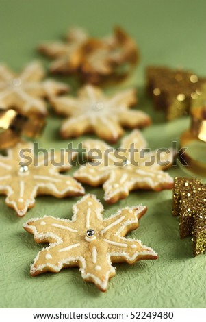 Snowflakes cookies for Christmas with white royal frosting and sparkling decorations