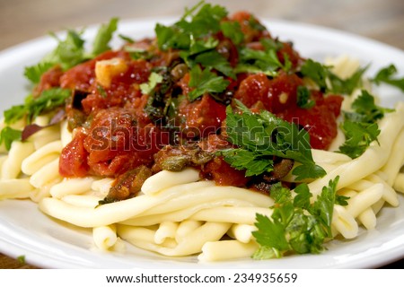 traditional and typical roman dish: pasta alla puttanesca