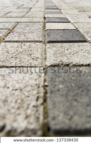 Gray and Black Square Paving Slabs. Close up image.