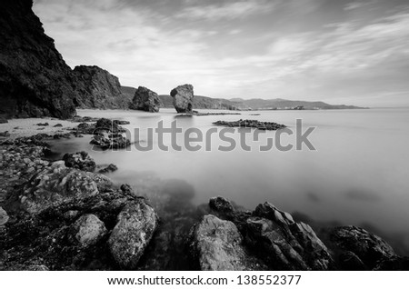 Long exposure photograph in black and white of one of the best beaches in Spain,with volcanic rocks and christal waters in the beach known like La Playa de Los Muertos ( Beach of the Dead ).Carboneras