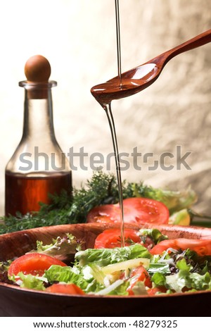 Olive oil poured over salad