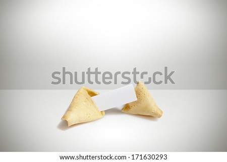 broken fortune cookie with paper tag