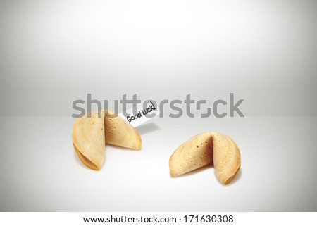 2 fortune cookies with good luck tag