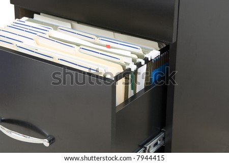 black cabinet  with opened drawer with files in folders