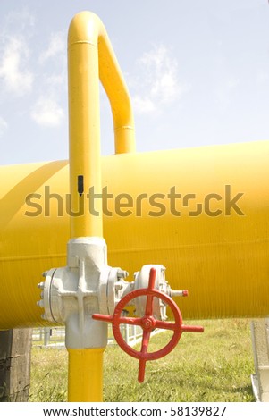 gas gate of red colour is on a pipe and blocks a pipe
