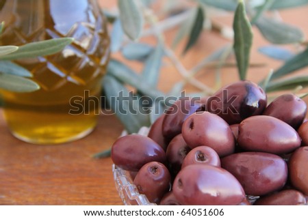 black Olives and Olive Oil on a wooden table