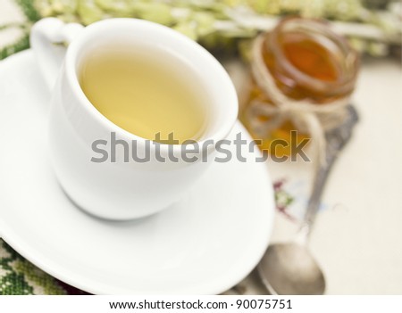 Herbal tea and fresh honey, shallow dof