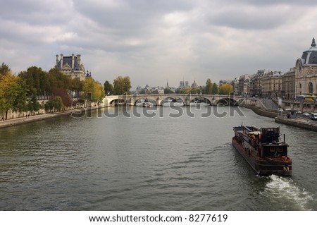 View on Seine river in Paris with Louvre and Museum d\'Orsay on the river banks