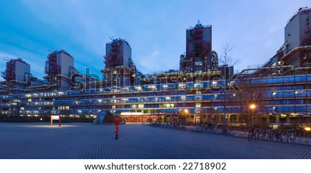 Building in high-tech architecture style in twilight